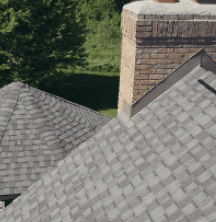 Gray asphalt shingle roof with brick chimney aerial view residential home