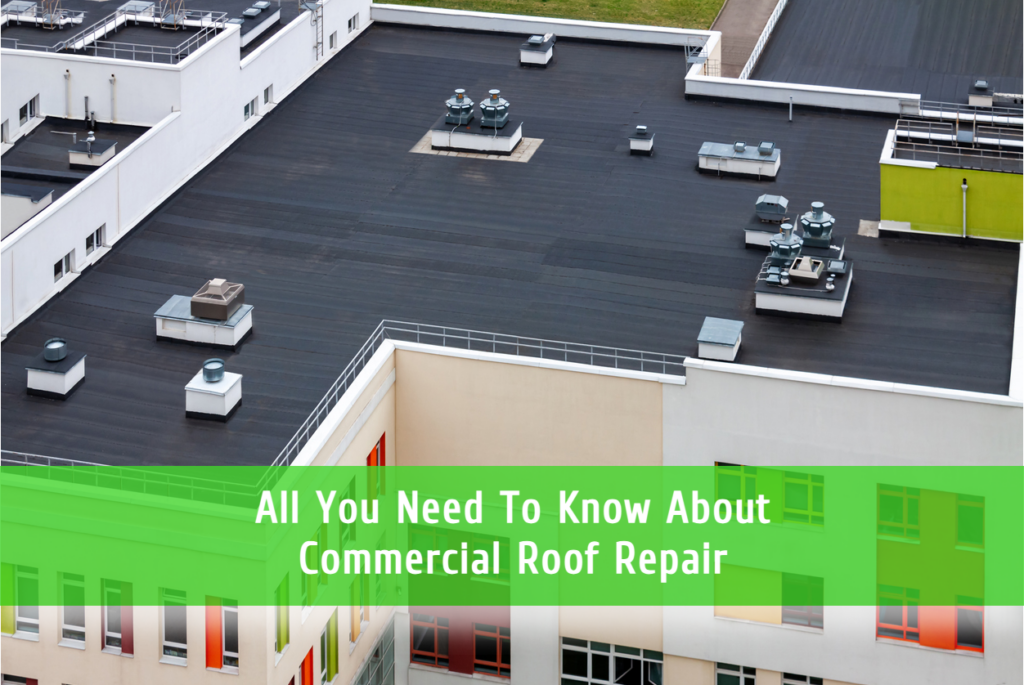 Commercial flat roof with HVAC units and equipment, aerial view of building