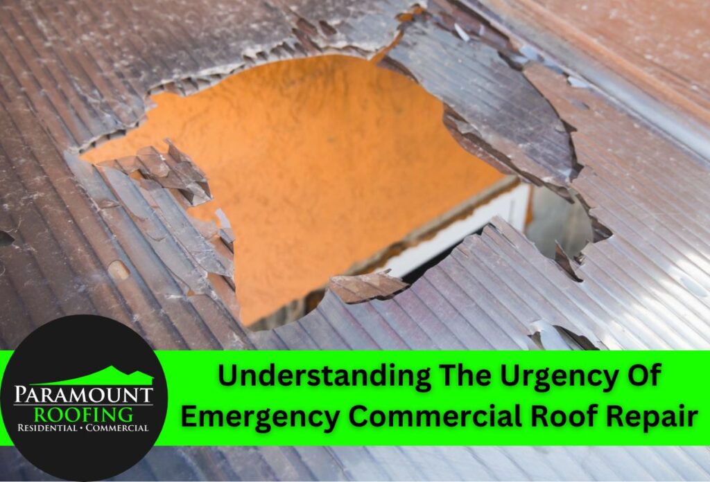 Damaged commercial roof with hole showing emergency repair needs