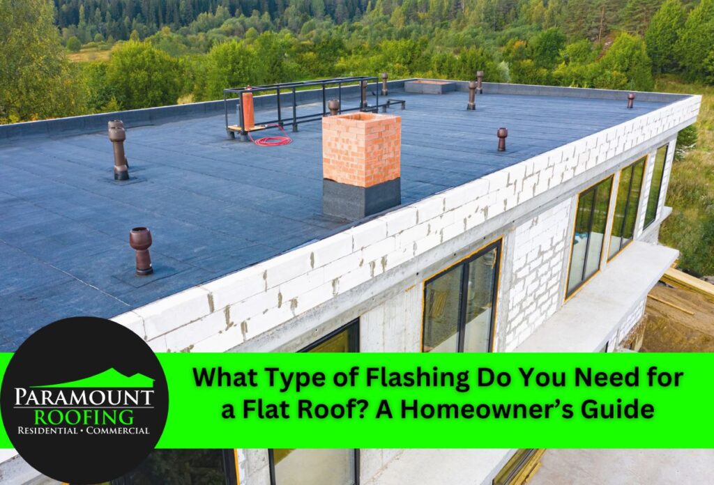 Flat roof construction with blue membrane, brick chimney, and ventilation pipes