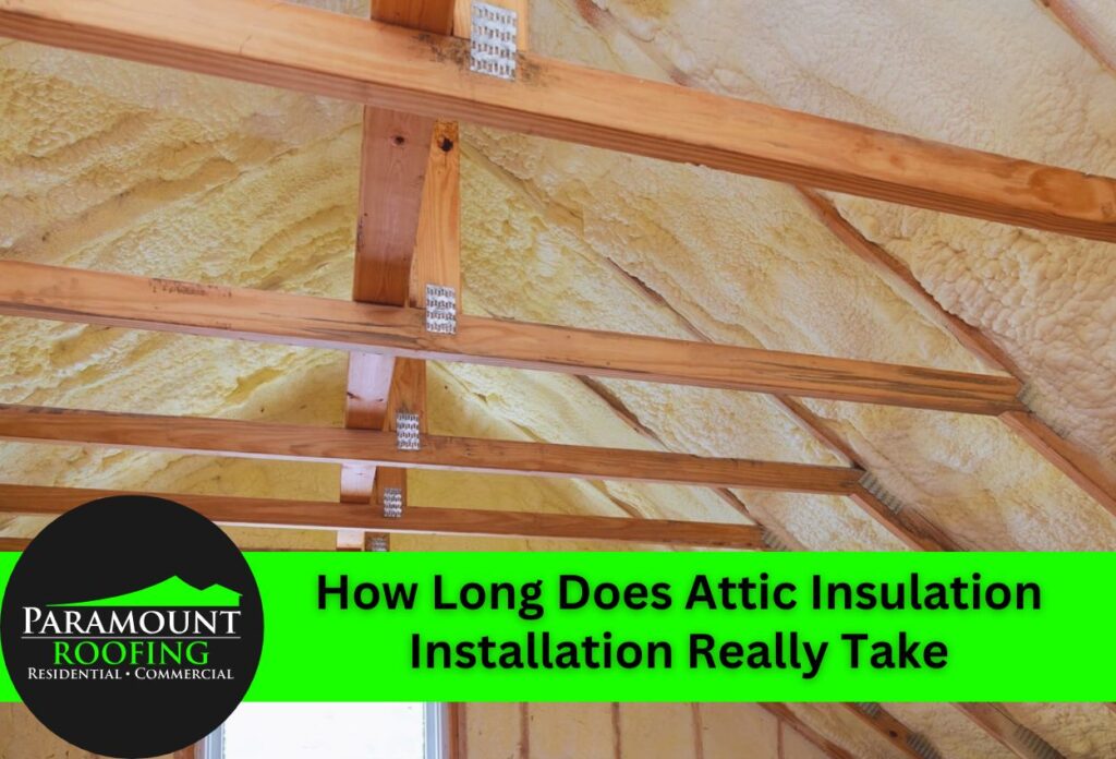 Attic insulation installation with wooden rafters and yellow fiberglass batts