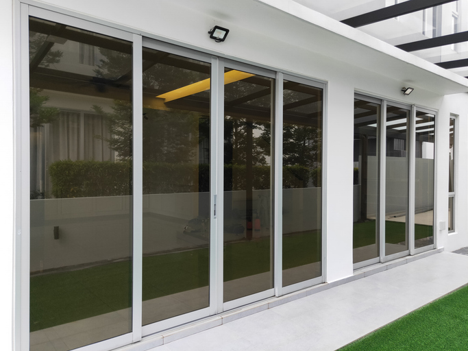 Large glass sliding doors on a modern patio