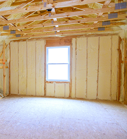 Insulated room with plywood flooring and wooden beams